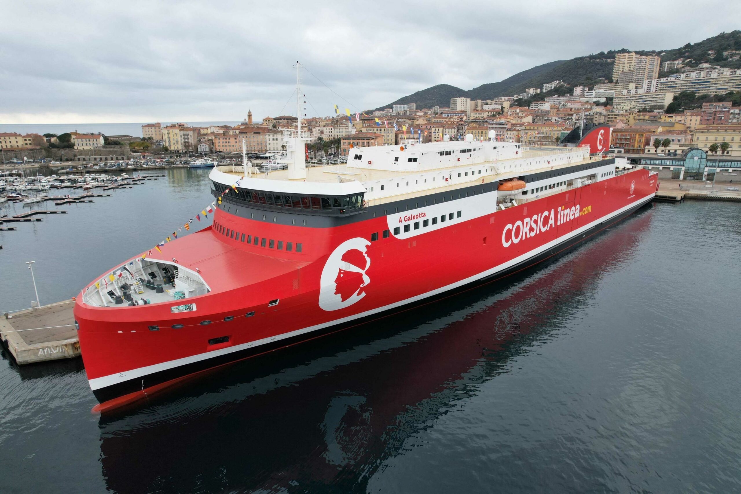 An aerial photograph taken on January 5, 2023 shows the brand new Corsica Linea ferry company boat A Galeotta during its inauguration at the commercial port of Ajaccio on the French Mediterraenan island of Corsica. - The new Corsica Linea ferry A Galeotta is the first liquefied natural gas vessel to serve Corsica. (Photo by Pascal POCHARD-CASABIANCA / AFP)